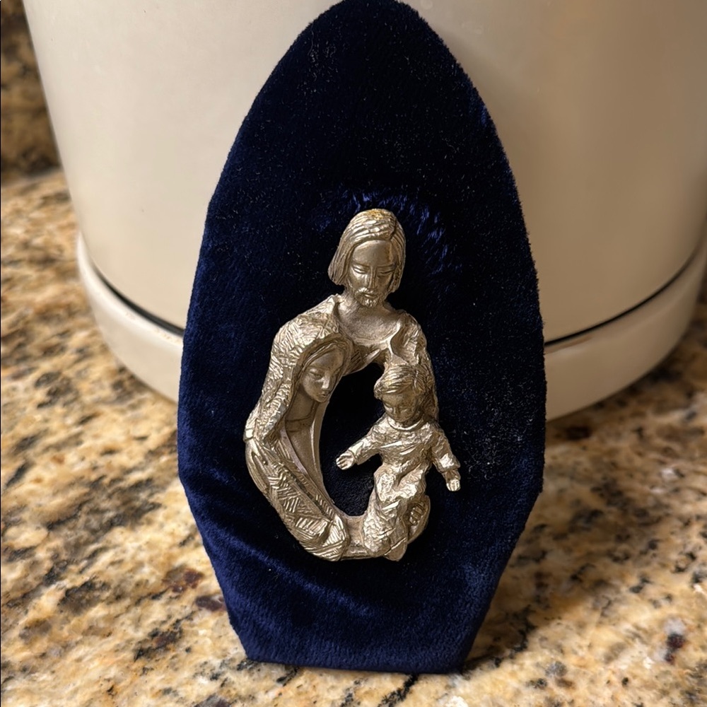 Silver Religious Figurine on Blue Velvet Stand
25th anniversary pewter